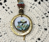 lineage of buffalo, enameled necklace pendant