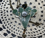 58 green winged heart vintage tin necklace